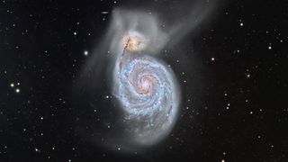 The iconic Whirlpool galaxy Messier 51 is pictured along with the smaller galaxy NGC 5195 at the top of the image.