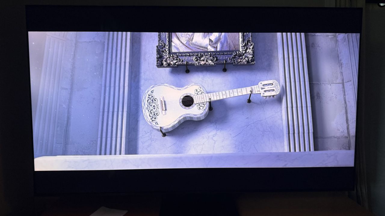 TCL QM7L TV showing its brightness with a scene from Coco
