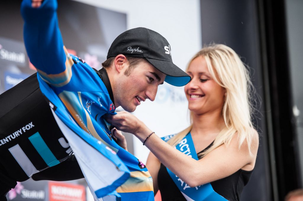 Gianni Moscon (Team Sky) pulls on the leader's blue jersey
