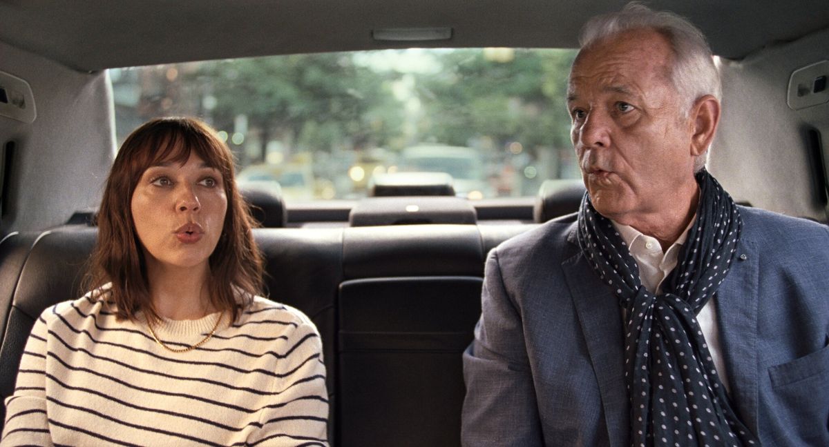 Rashida Jones and Bill Murray sitting in a cab