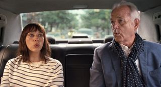 Rashida Jones and Bill Murray sitting in a cab