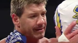 Eddie Guerrero looking at Rey Mysterio