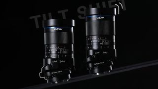 Two Laowa tilt shift lenses against a white background