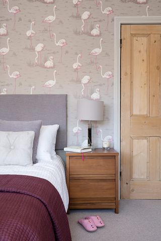 Grey bedroom with flamingo wallpaper