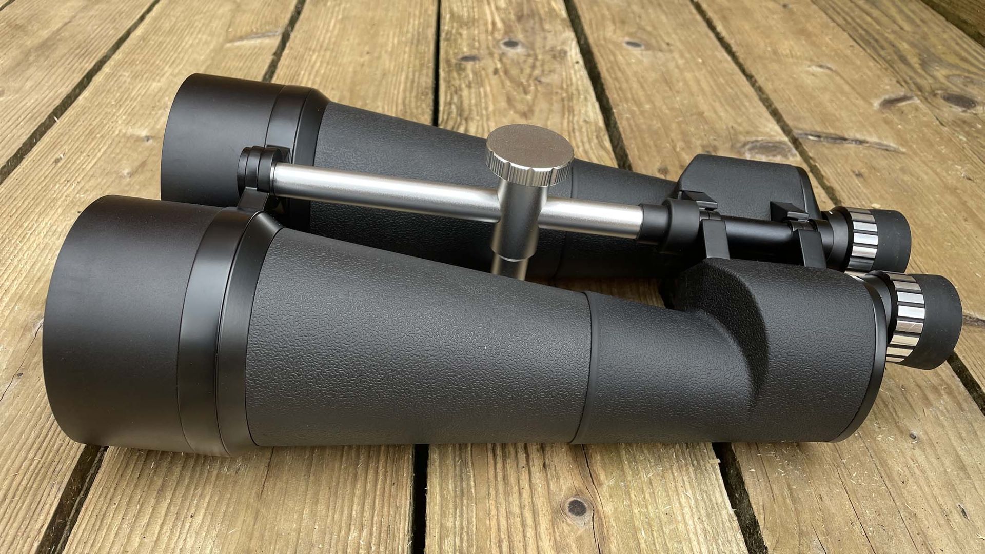 Celestron SkyMaster 25x100 on a wooden table