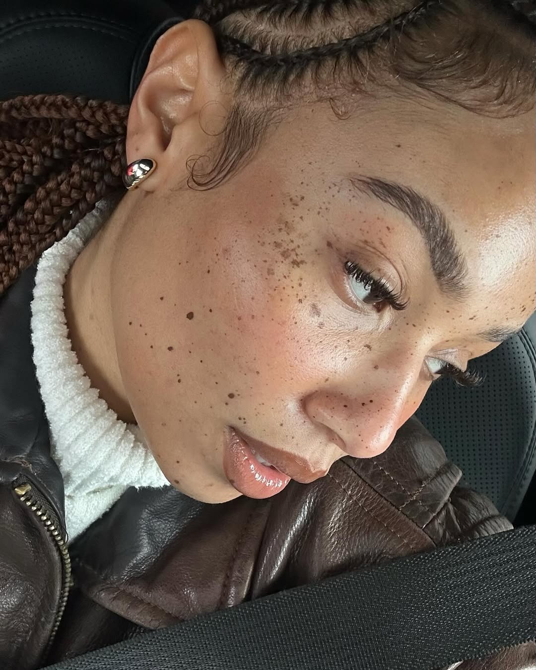 Symphani Soto shows off her natural freckles and laid edges