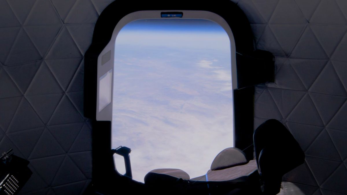 A view of the Earth below from with massive window on Blue Origin's New Shepard spacecraft.