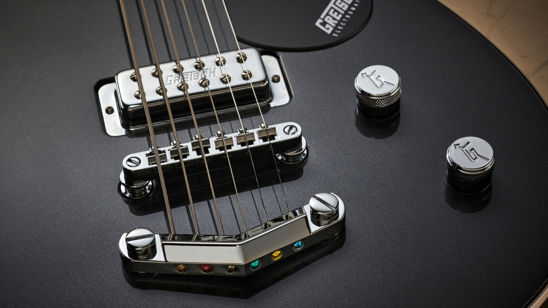 Close up of the bridge on a Gretsch baritone guitar