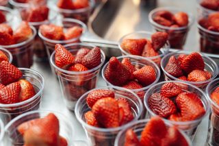 Strawberries in plastic cups