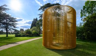 Ai Weiwei, Gilded Cage (2017), a gold metal sculpture which explores the refugee crisis. Photography: Pete Seaward, courtesy of Blenheim Art Foundation