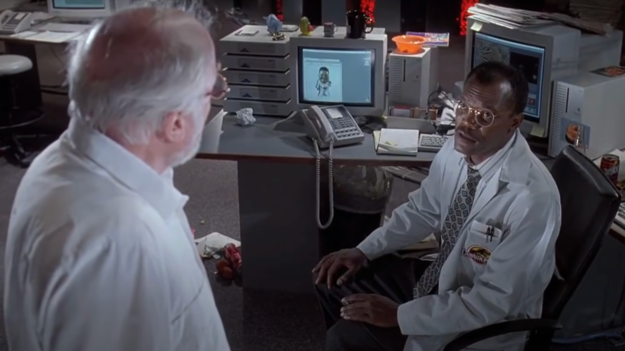 Sir Richard Attenborough and Samuel L Jackson talk in the control room in Jurassic Park.