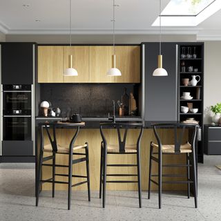 Black and wood kitchen with smart kitchen island and ribbed finish on cabinet doors