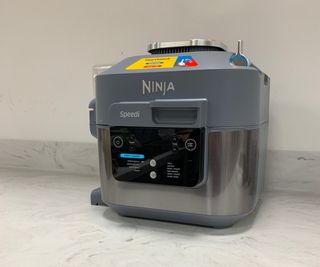 Ninja Speedi Rapid Cooker and Air Fryer against the kitchen wall.