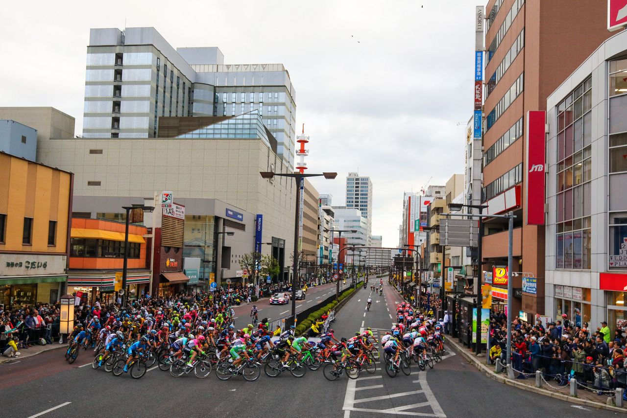 The peloton rounds a corner