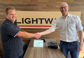 Sven Pelters shakes the hand of boss at Lightware.