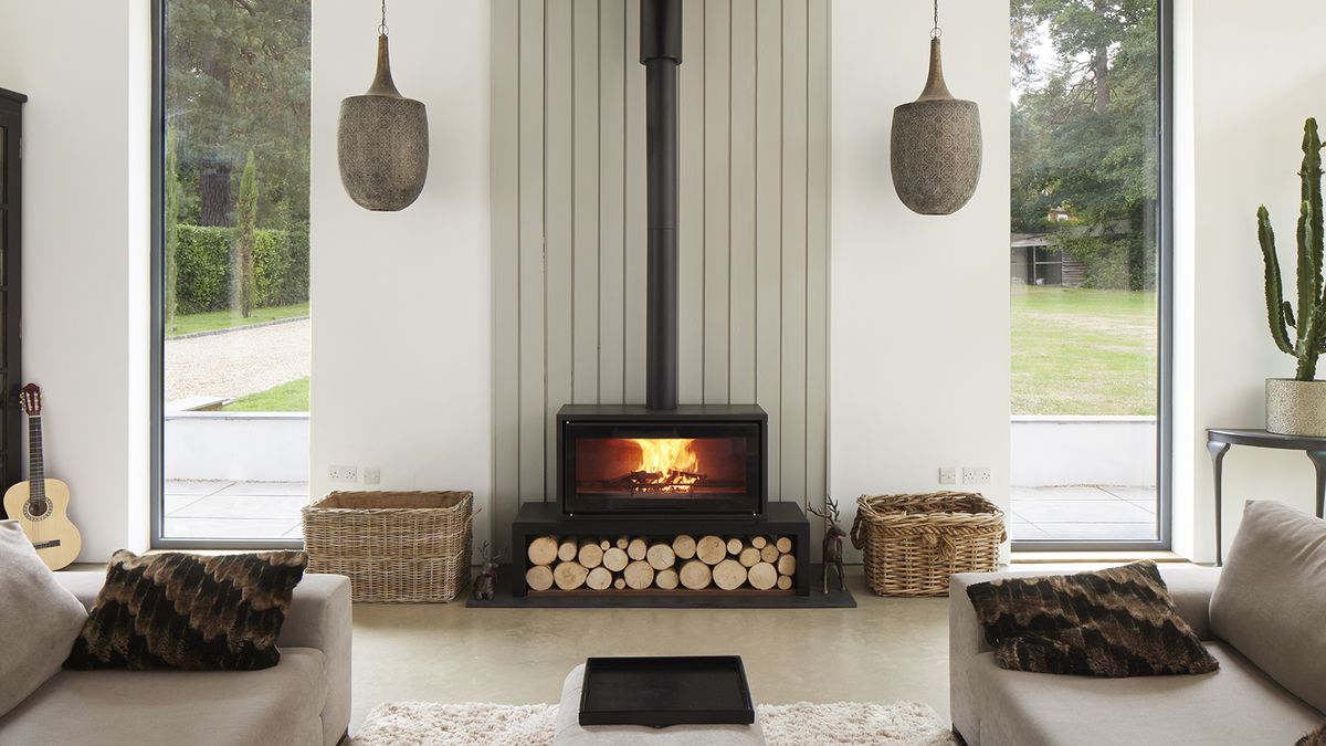 A contemporary log burner with symetrical hanging pendant lights