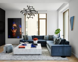 a modern living room with blue accent