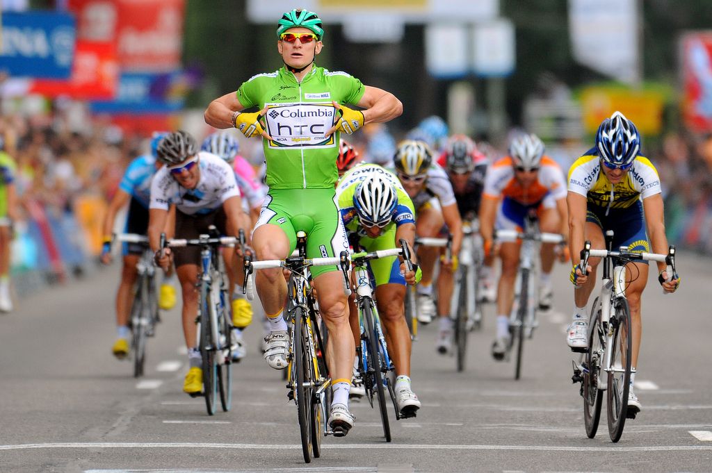 Andre Greipel points to the team sponsor in celebration of his stage 21 2009 Vuelta a Espana victory