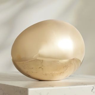brass egg sculpture