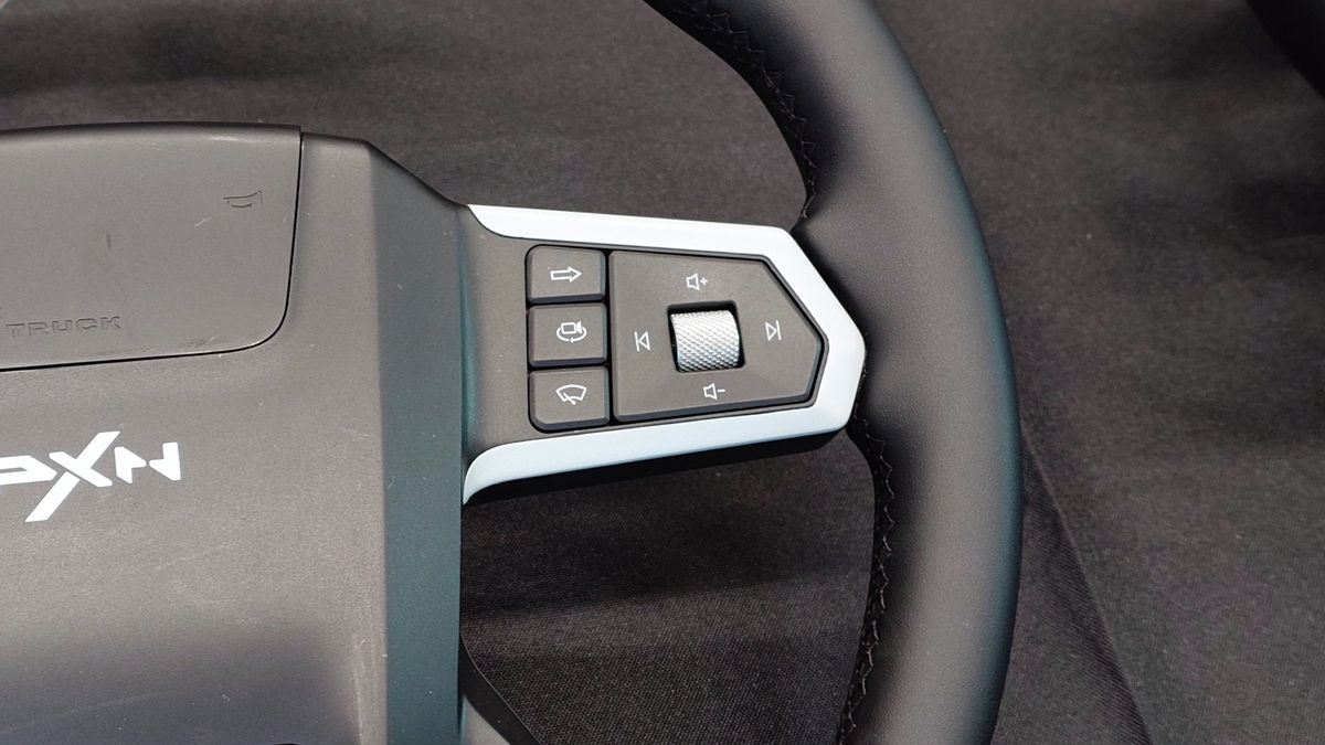 Close up photos of the new and unreleased PXN truck simulator wheel showing the design and controls.