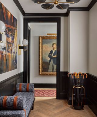 entryway with white walls and black trim