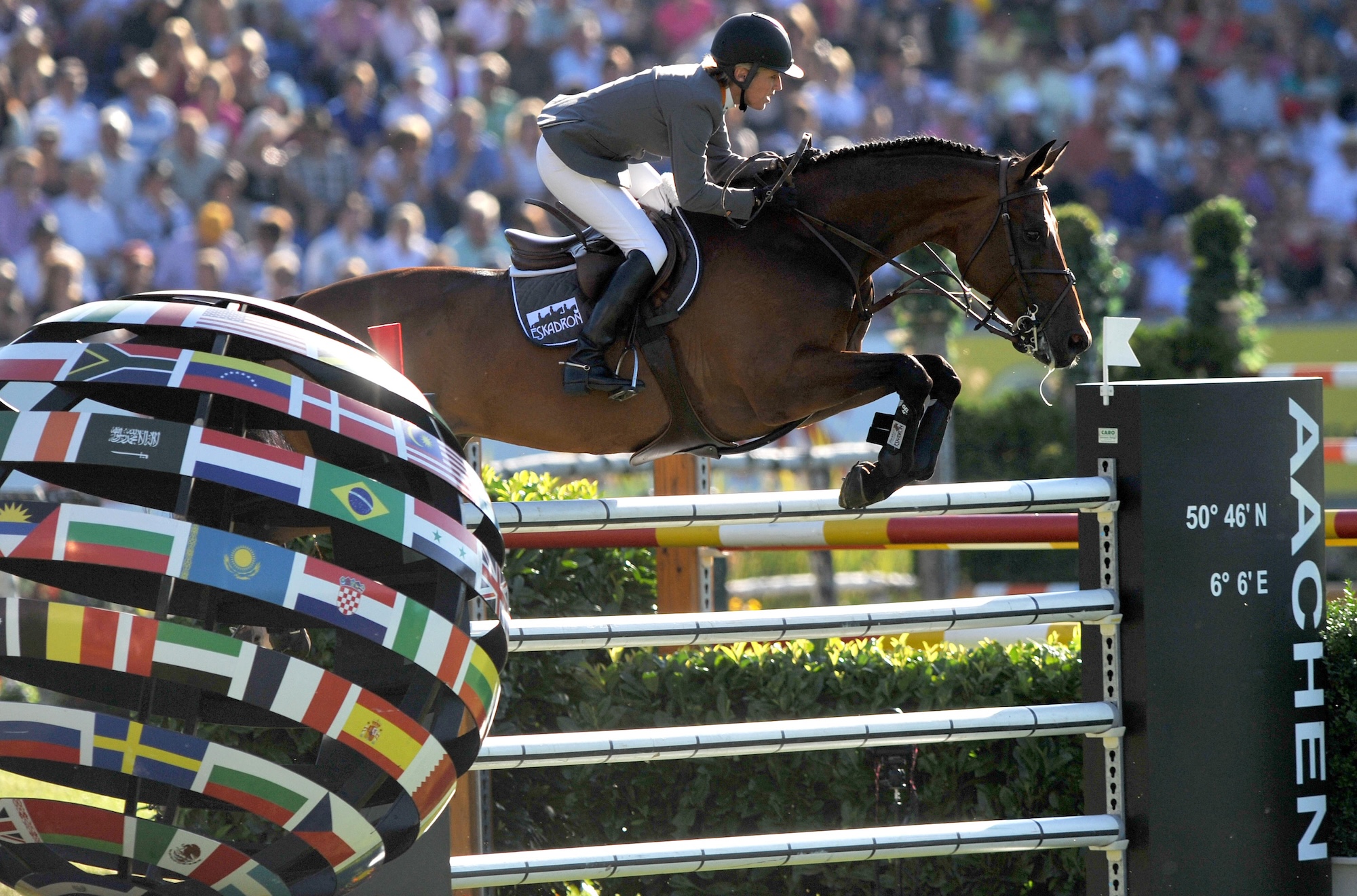 Showjumping clearing Aachen globe jump in equestrian arena