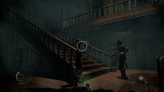 A guard looking around in front of a staircase in Thief (2014).