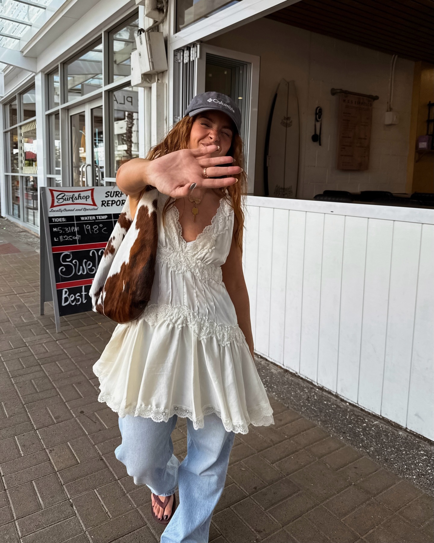 Woman in lace trim satin dress over jeans