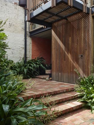 Internal courtyard entry at Stockroom Cottage by Architects EAT