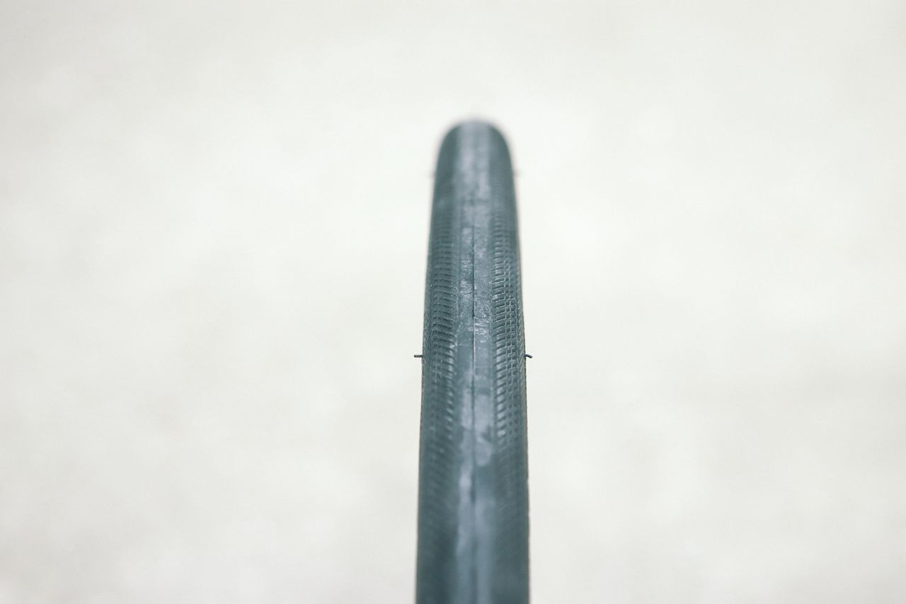 a close up of a black road bike tyre
