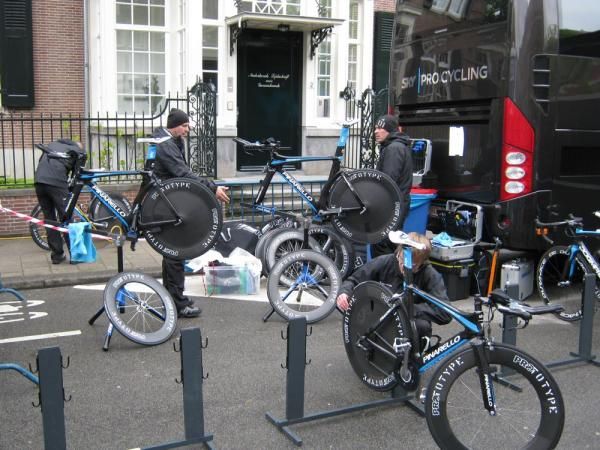 The Team Sky mechanics work on the bikes in the start area