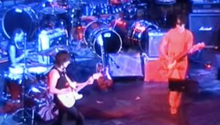 (from left) Meg White, Jeff Beck and Jack White perform onstage at London's Royal Festival Hall on September 13, 2002