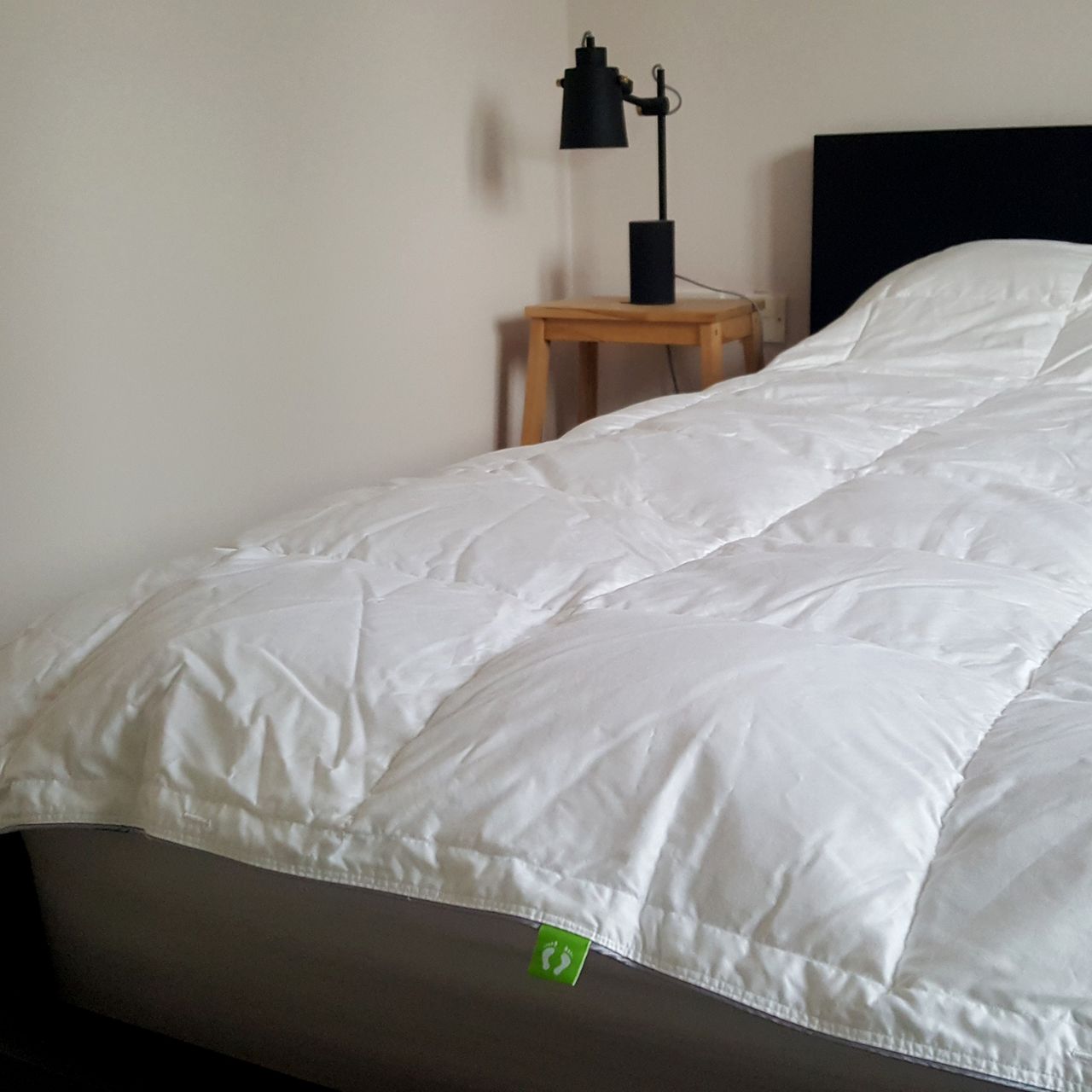 The scooms All-Season Hungarian Goose Down Duvet on a bed being tested