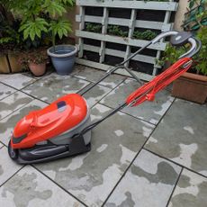 Flymo Easiglide 300v Electric Hover lawn mower on a patio