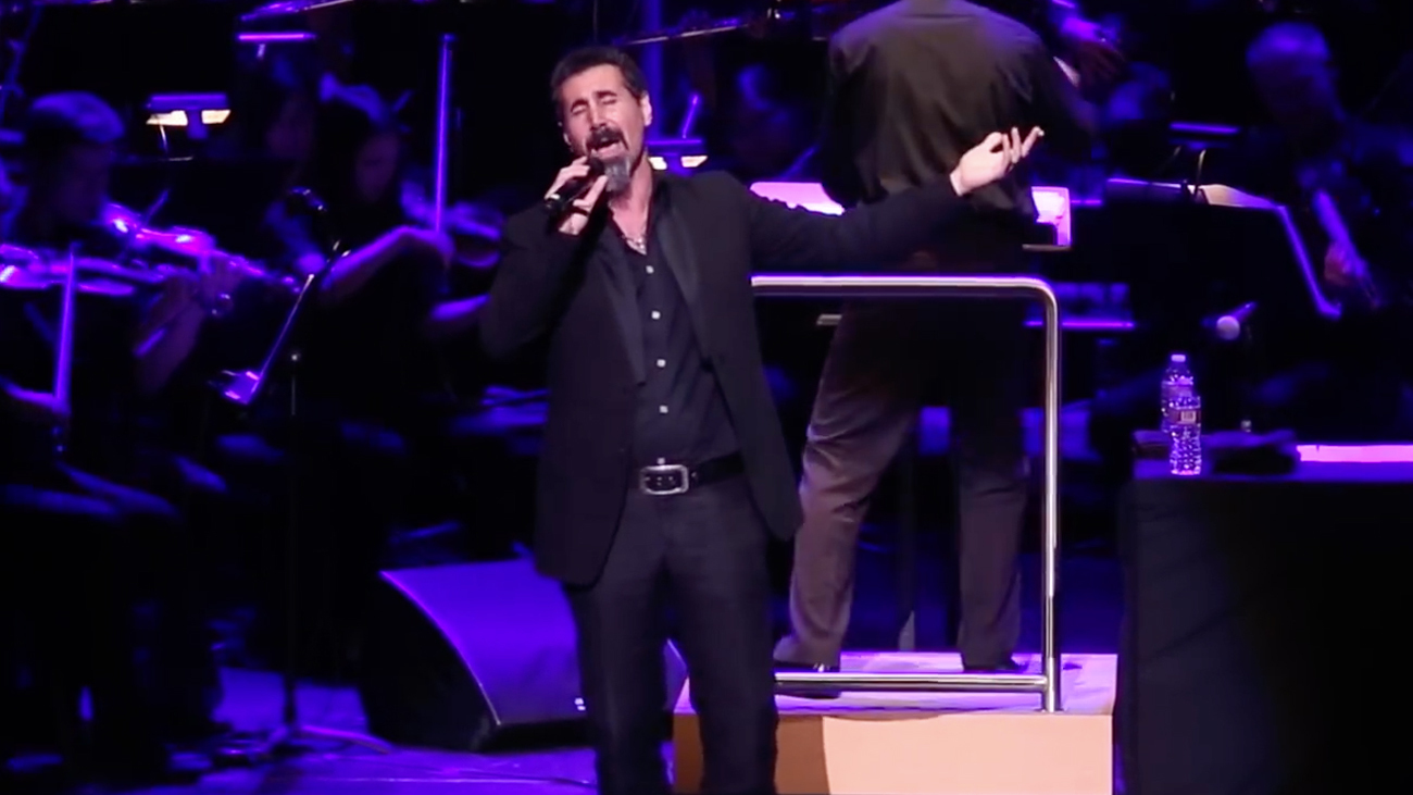 A picture of Serj Tankian performing with the CSUN Symphony