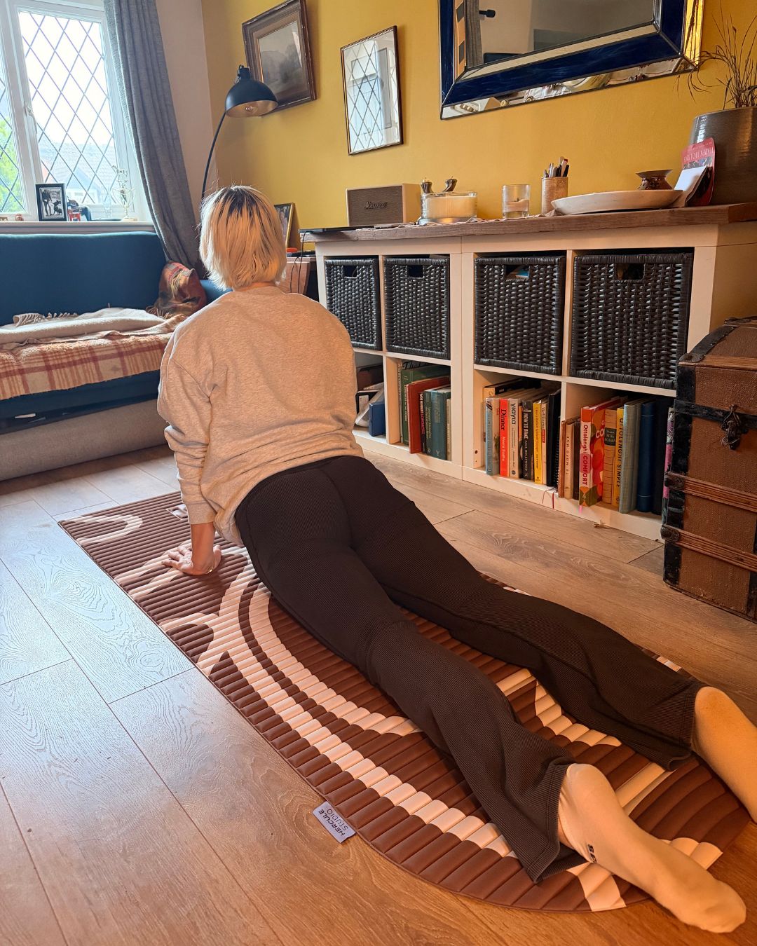 Engaging her core and glutes to lift her chest and hips off the mat meant Ash didn't get any pain in her back