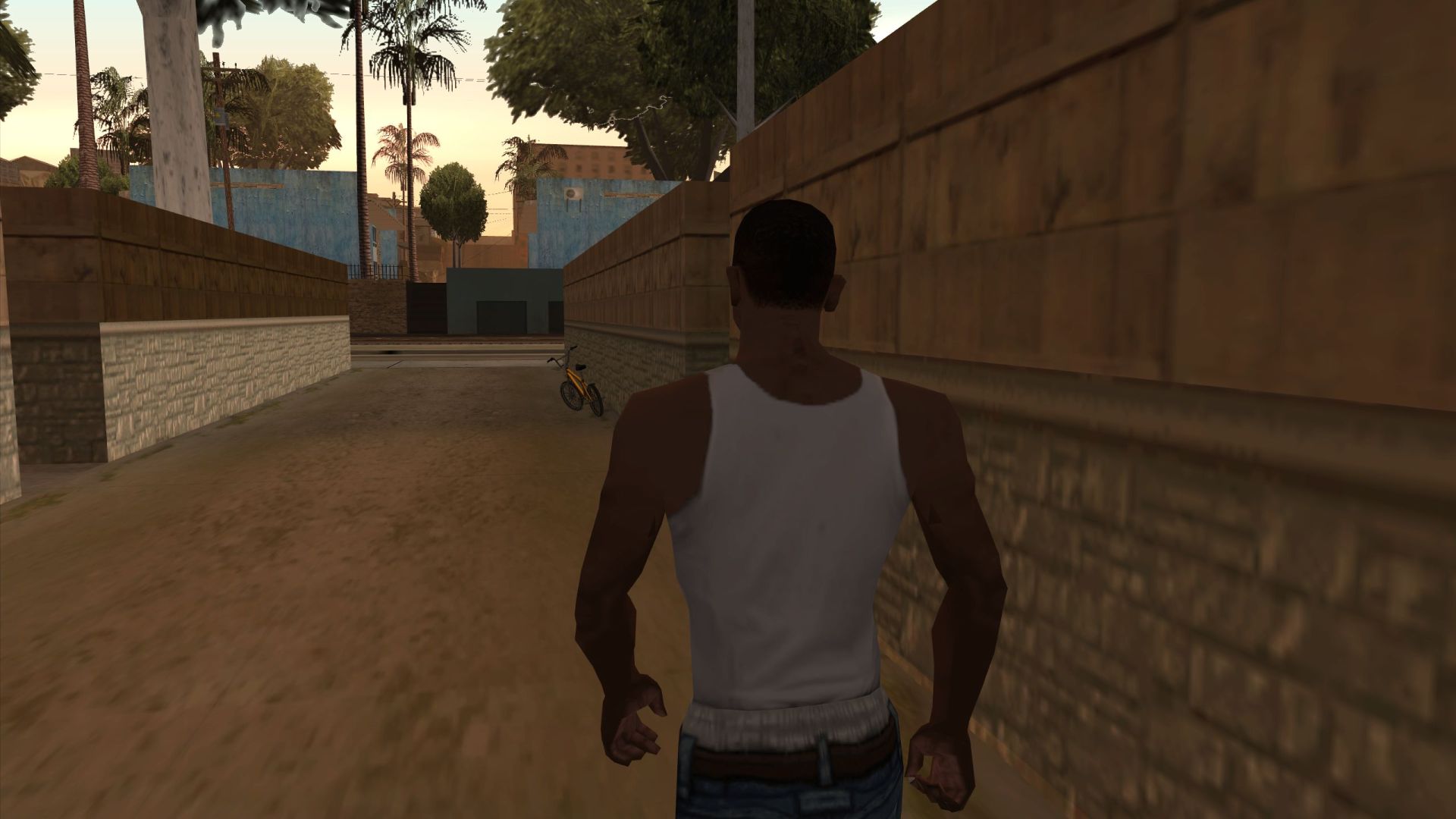 CJ walks down an alley toward a bicycle