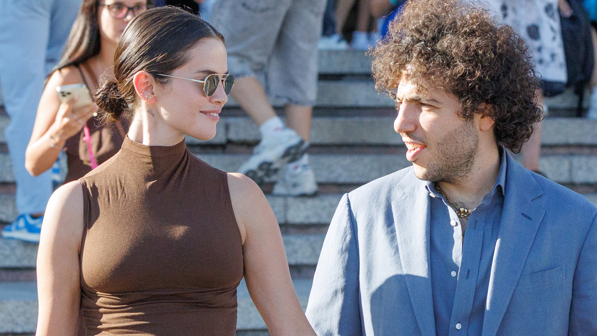 Selena Gomez styled a brown turtleneck with a matching suede maxi skirt and shiny fall boots