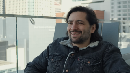 Eric Barone smiling and talking about Stardew Valley 