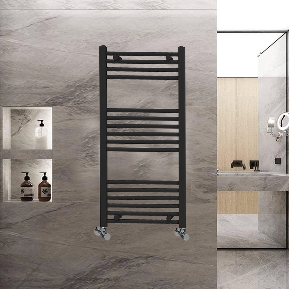 Black heated towel rail in a grey marble bathroom