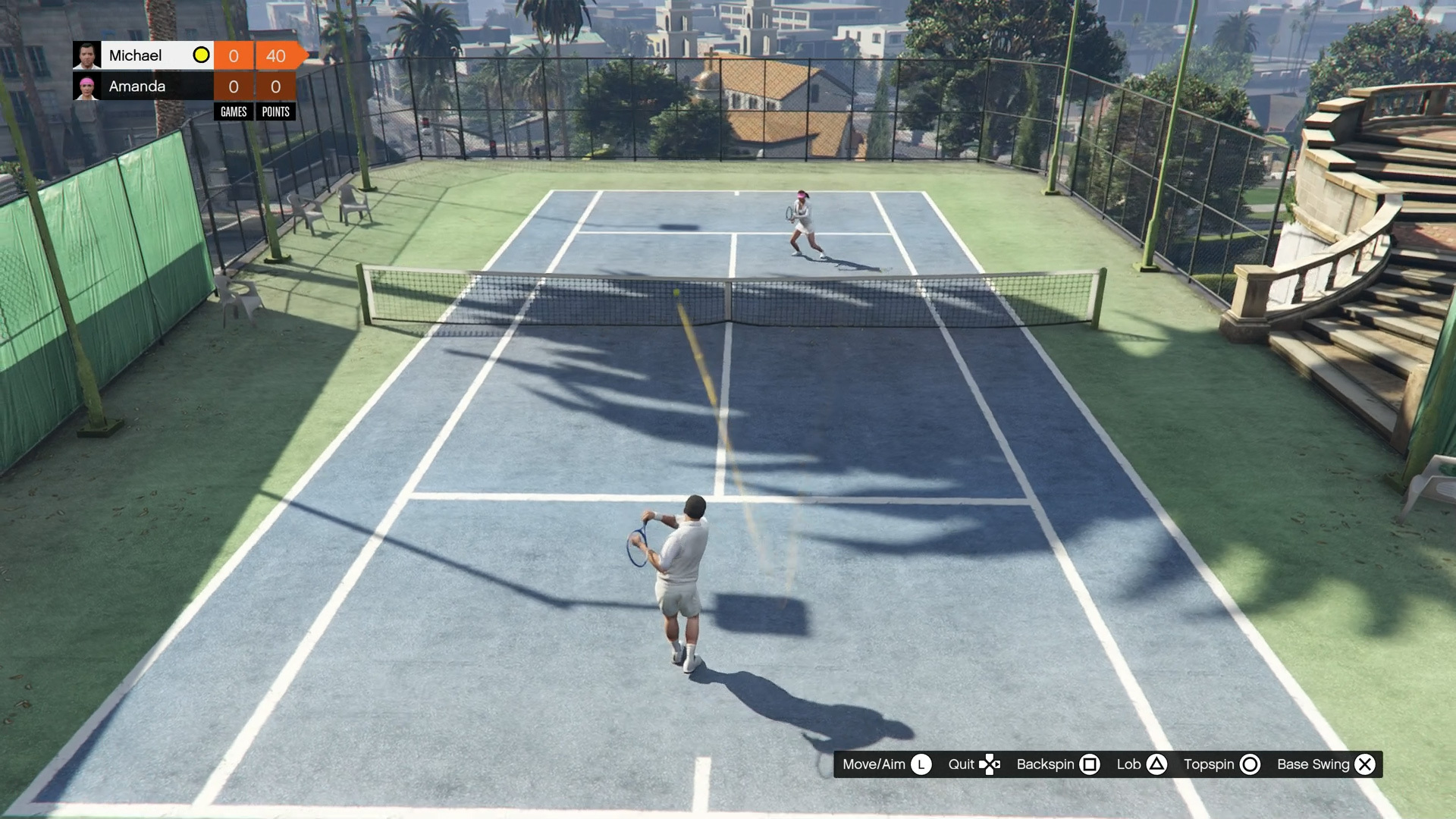 GTA 5 screenshot of Michael playing tennis on the court against Amanda