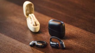 Two pairs of Panasonic RB-F10 open earbuds in black and beige