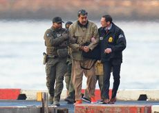 Nicol&aacute;s Maduro in handcuffs after landing at a Manhattan helipad