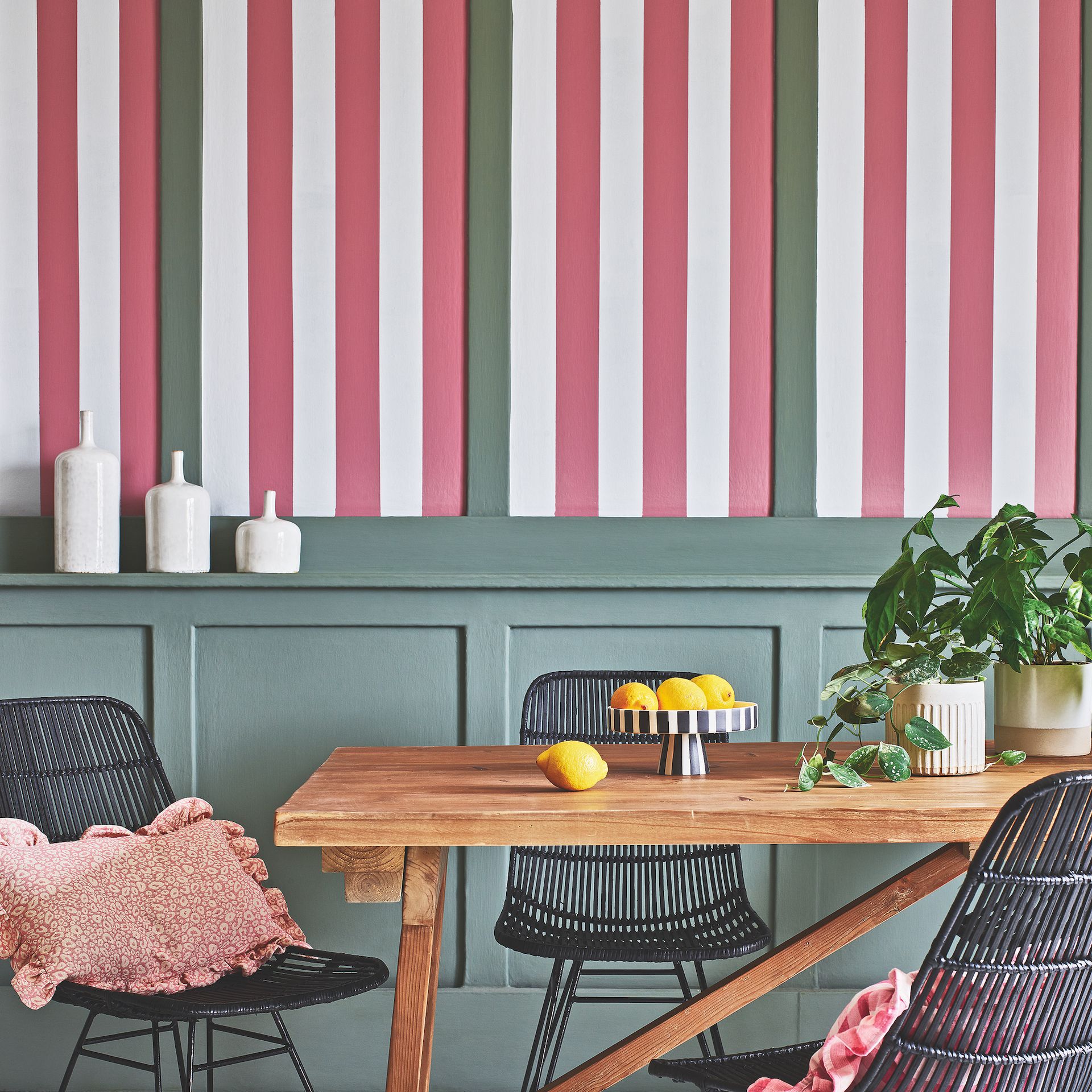 dining area with panelling bold stripes wall and wooden dining table with chairs