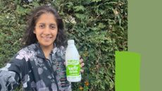 Minreet Kaur holding bottle of kefir, drinking it after learning the benefits of drinking kefir every day for breakfast
