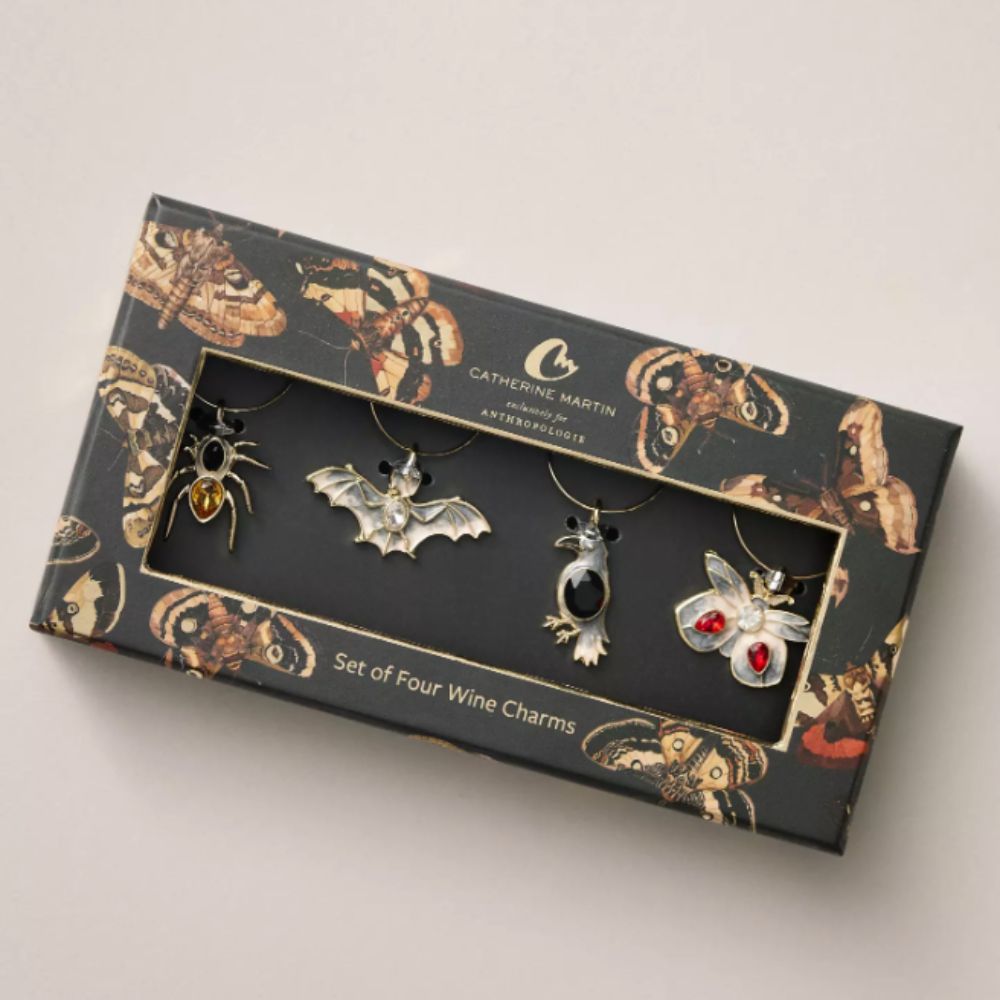Box of wine charms in moth, bat, spider and bird designs