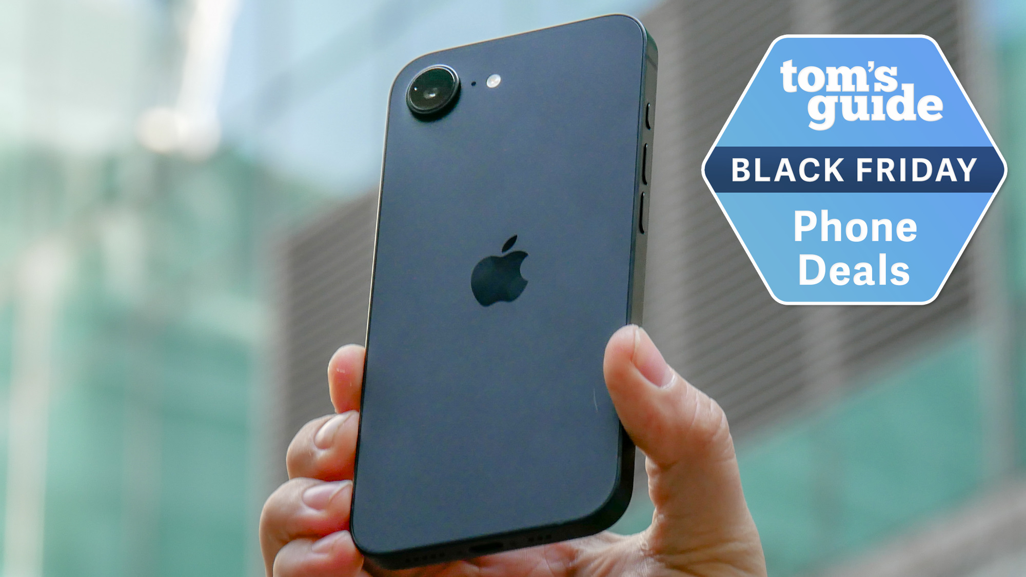 iPhone 16e held in the hand with Black Friday badge nearby.