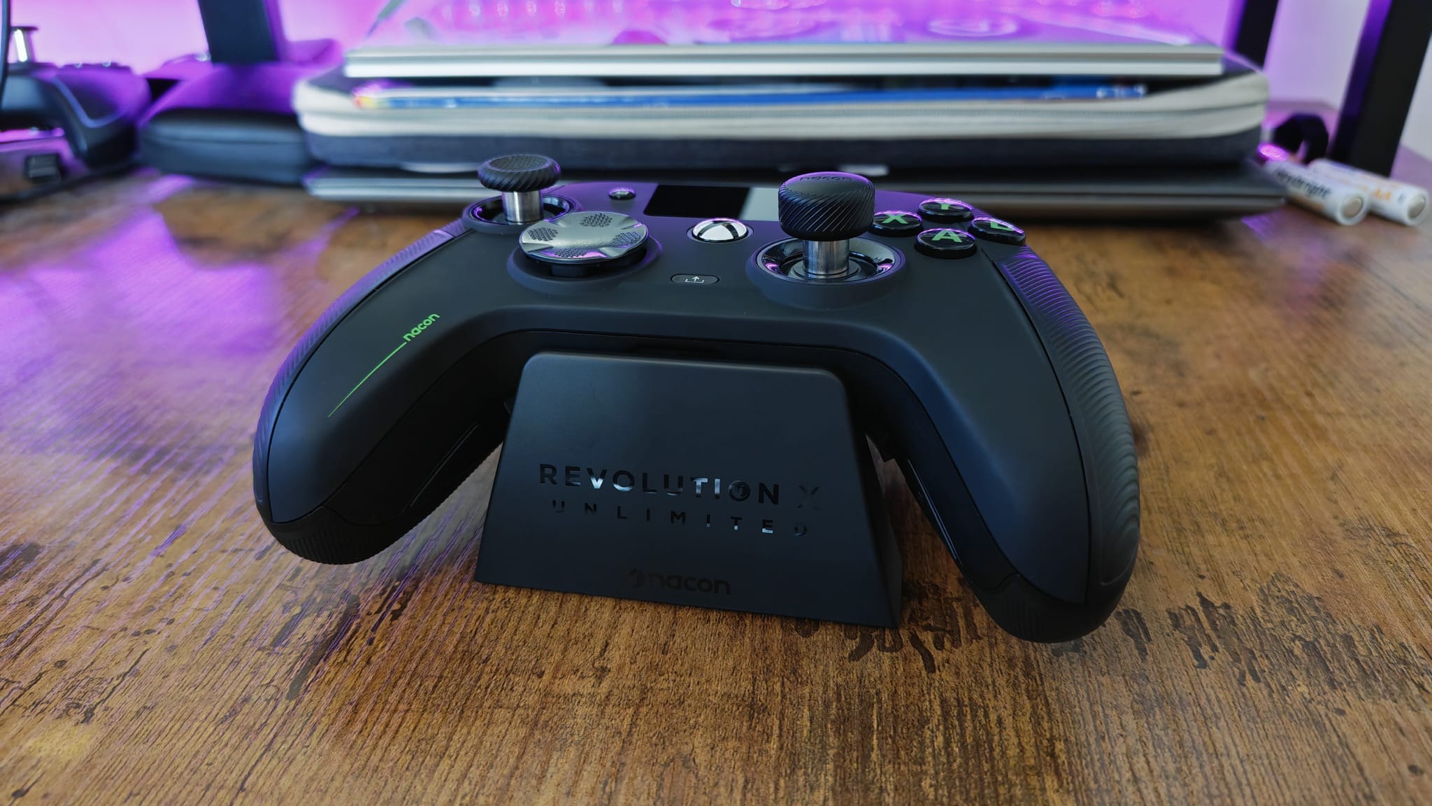 A Nacon Revolution X Unlimited review image of the controller lying on its charging stand