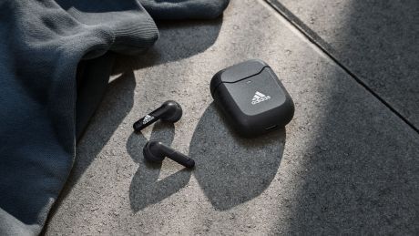 Adidas Z.N.E. 01 Wireless Headphones next to case