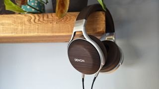 The Denon AH-D5200 and other headphones, photographed on a home desktop.